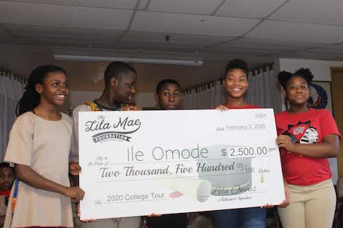 Students receiving scholarship from the Lila Mae Foundation