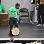 8th grader Ababacar leading the drummers